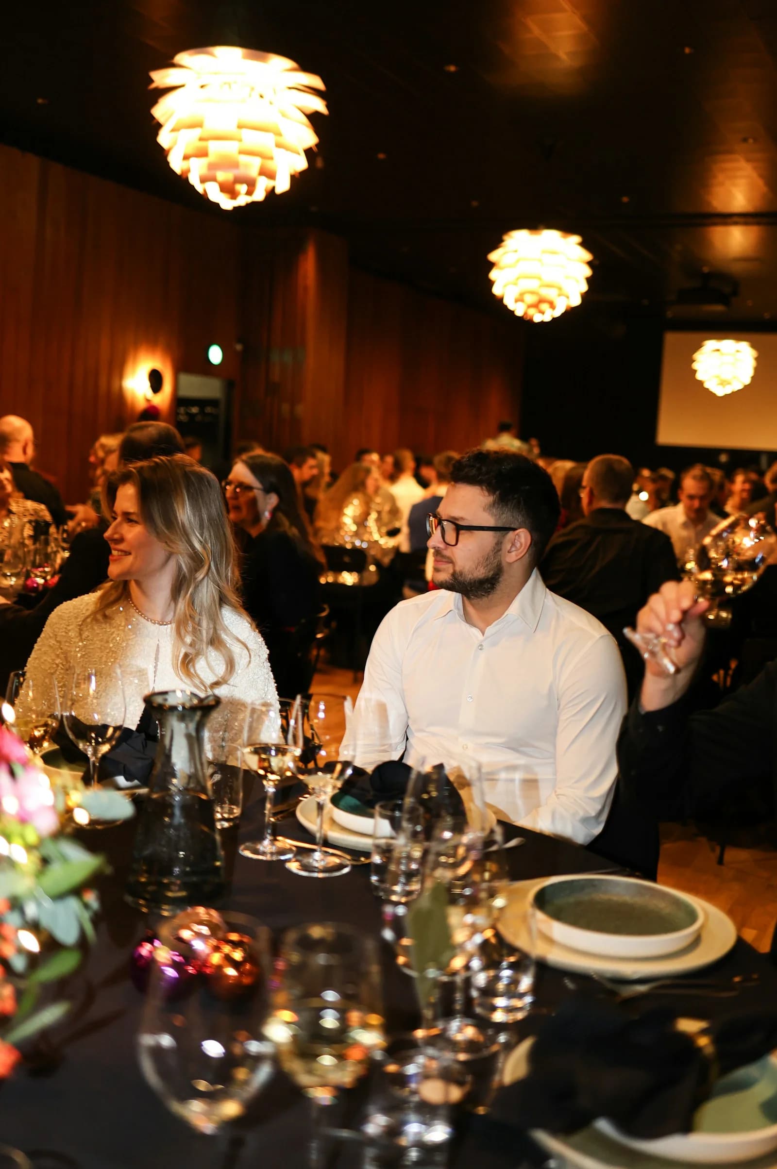 Guests sharing an evening at an intimate formal dinner